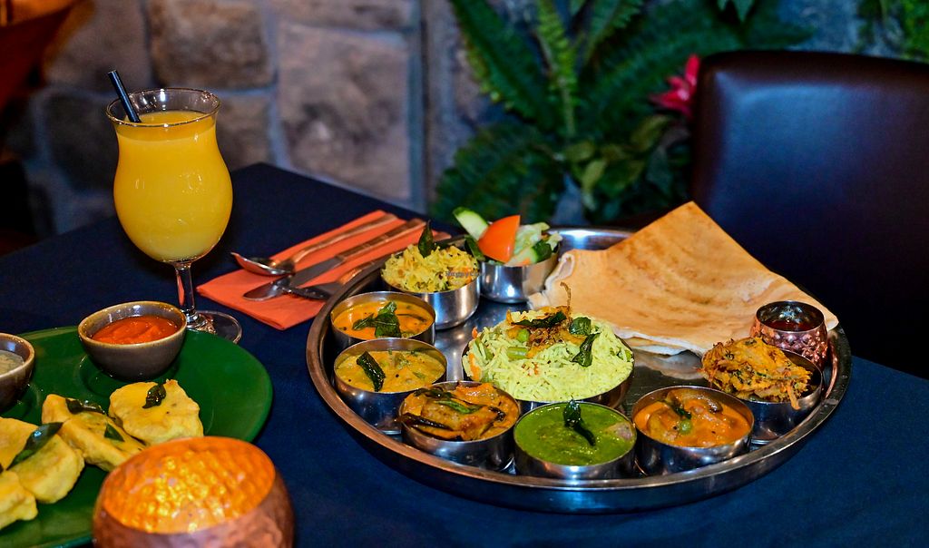 A traditional Kerala thali platter with dosa, rice, sambar and a variety of curries at Herb Restaurant